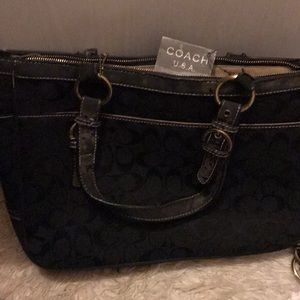 Coach purse , still has tags on it , used lightly